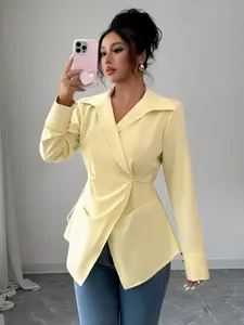 A yellow collared, fitted, belt-wrapped, slit-front, long-sleeved blouse for ladies. It has a simple and elegant style and is suitable for both formal gatherings and casual indoor/outdoor wear.