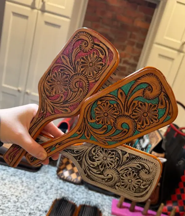 Genuine hand tooled leather hair brush