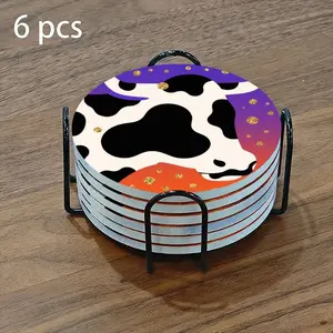 6-piece ceramic coaster set, featuring a black and white cow head illustration with gold dots. These heat-resistant, non-slip coasters come with a stand and are perfect for home, dining, or as beverage mats.