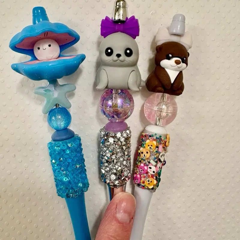 Claim on live!!!  Glam pens, 3D printed, snow Globe, Gliw Pens. 3 for $15.   Beaded Pens with Silicone Focals Featuring Adorable Animal Toppers and Sparkling Beads for Fun Writing