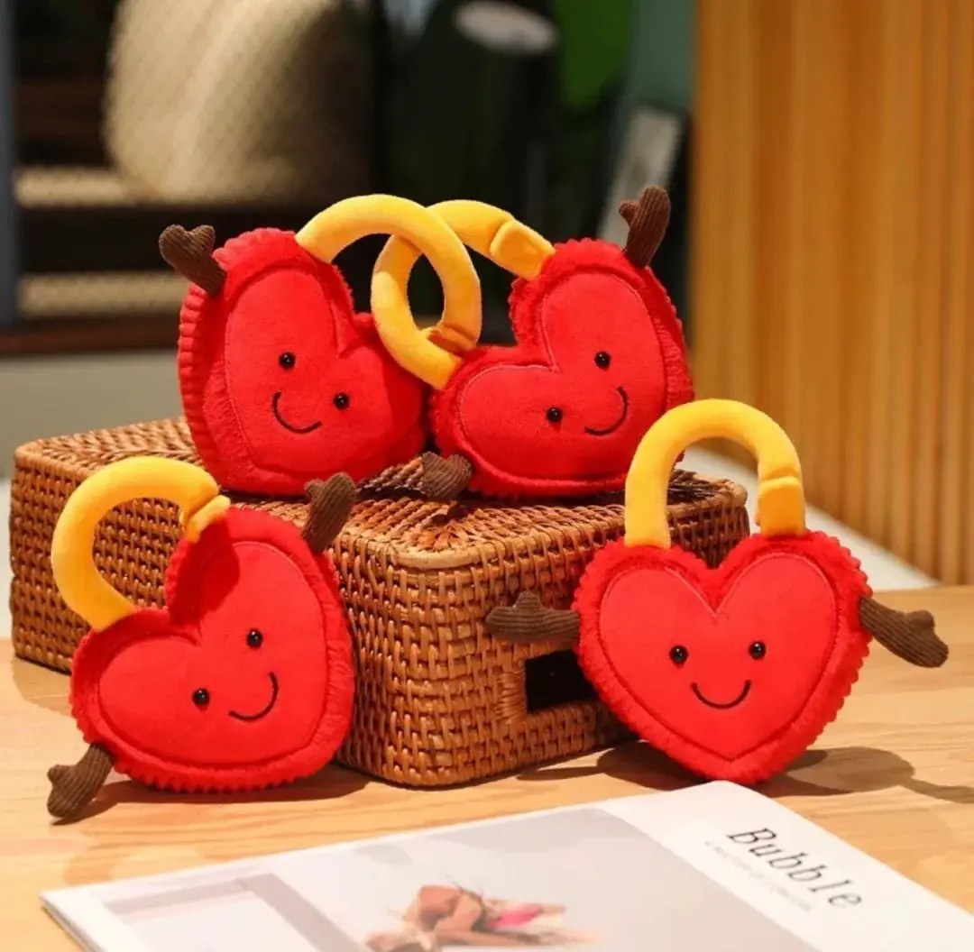 This pair of red, heart-shaped padlocks—embroidered with a smiley face—makes a meaningful gift, symbolizing sweet "love locks." A unique feature is their versatility: the two locks can be hooked together or separated.