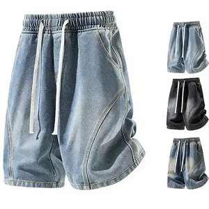 Loose denim shorts — elastic waistband with drawstring, washed gradient finish, unique cut, exposed seams; casual mid-thigh denim shorts for a relaxed summer street style.