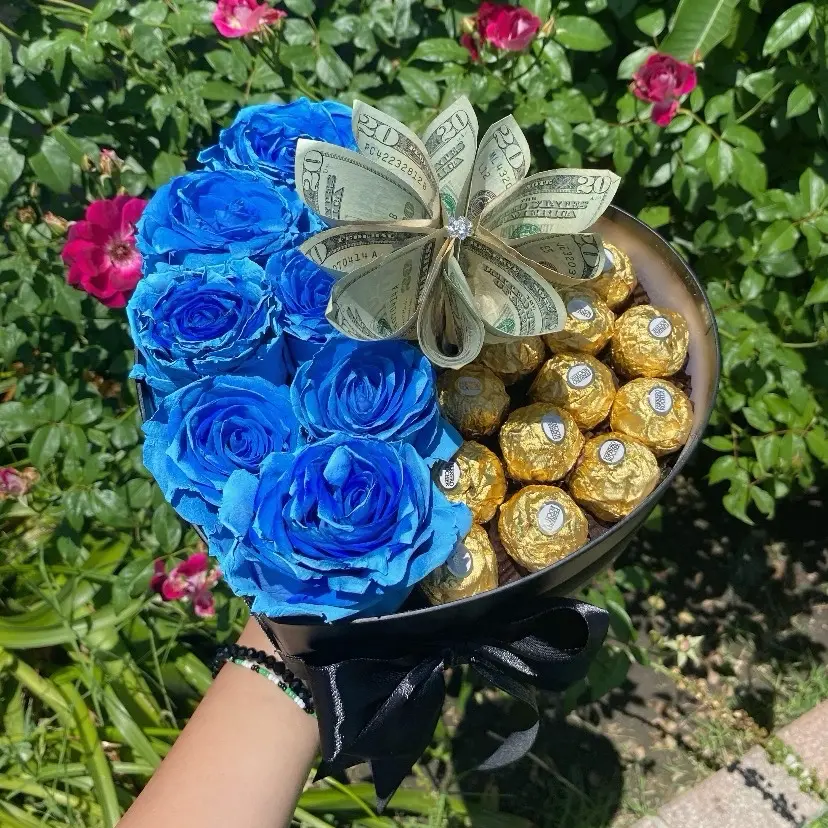 Flower Arrangement- Heart shaped box with enternal roses and chocolates. Money NOT included.