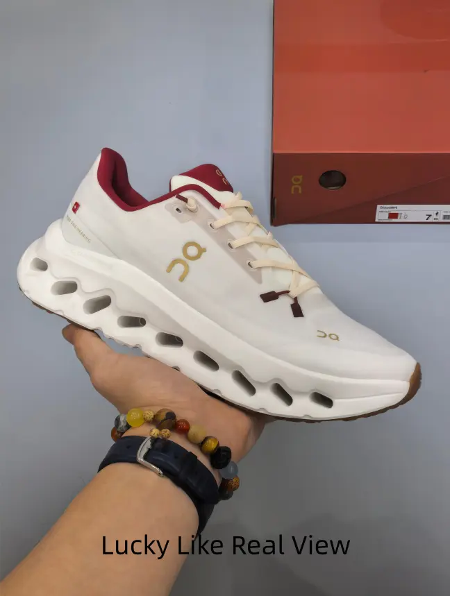 Cream White Breathable Knit Running Shoes Burgundy Red Collar Accent Gold Side Logo Hollow Cutout Cloud Chunky Midsole Wear-resistant Gum Rubber Outsole For Daily Jogging Outdoor Trail Hiking Athleisure Street Outfit Matching