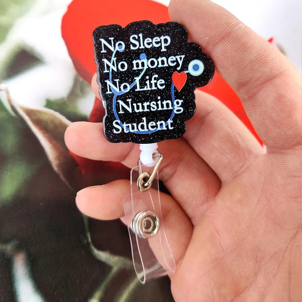 A nursing student theme work card retractable buckle, the main body is designed with black glitter, equipped with a retractable structure and a transparent clip, which can be used to hang work cards. Id Badge Holder Nurse Badge Reel