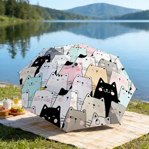 Portable folding umbrella The umbrella features a pattern of cartoon cat faces in various pastel colors like pink, blue, and gray, with some black cats interspersed throughout. Suitable for daily travel use, holiday Gift