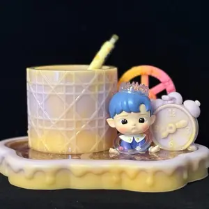 Handmade resin pen/makeup brush holders with liquid glitter base decorated with Popmart Hacipupu blindbox figurine.