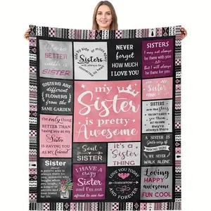 A cozy flannel blanket with a patchwork design and a comfortable pink-and-black color scheme—available in multiple colors. A perfect gift for sisters.