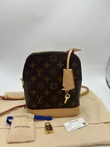 Pre-owned Louis Vuitton 04302 Alma shell style backpack, classic monogram canvas with off white leather trim, gold tone hardware, size 15 × 20 × 10 cm, includes dust bag, lock, and keys; Retail Price: $2720