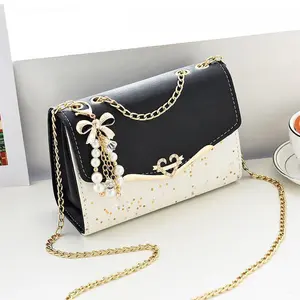 Women's Glitter Sequin Crossbody Bag - Stylish Shoulder Purse with Golden-Tone Chain Strap, Pearl & Bow Accents, Black & White Design for Everyday Use