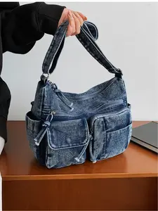 Light blue denim multi-pocket large capacity crossbody bag, vintage distressed workwear style shoulder bag, casual commuting tote bag, Casual commuter bag, suitable for commuting, everyday accessories