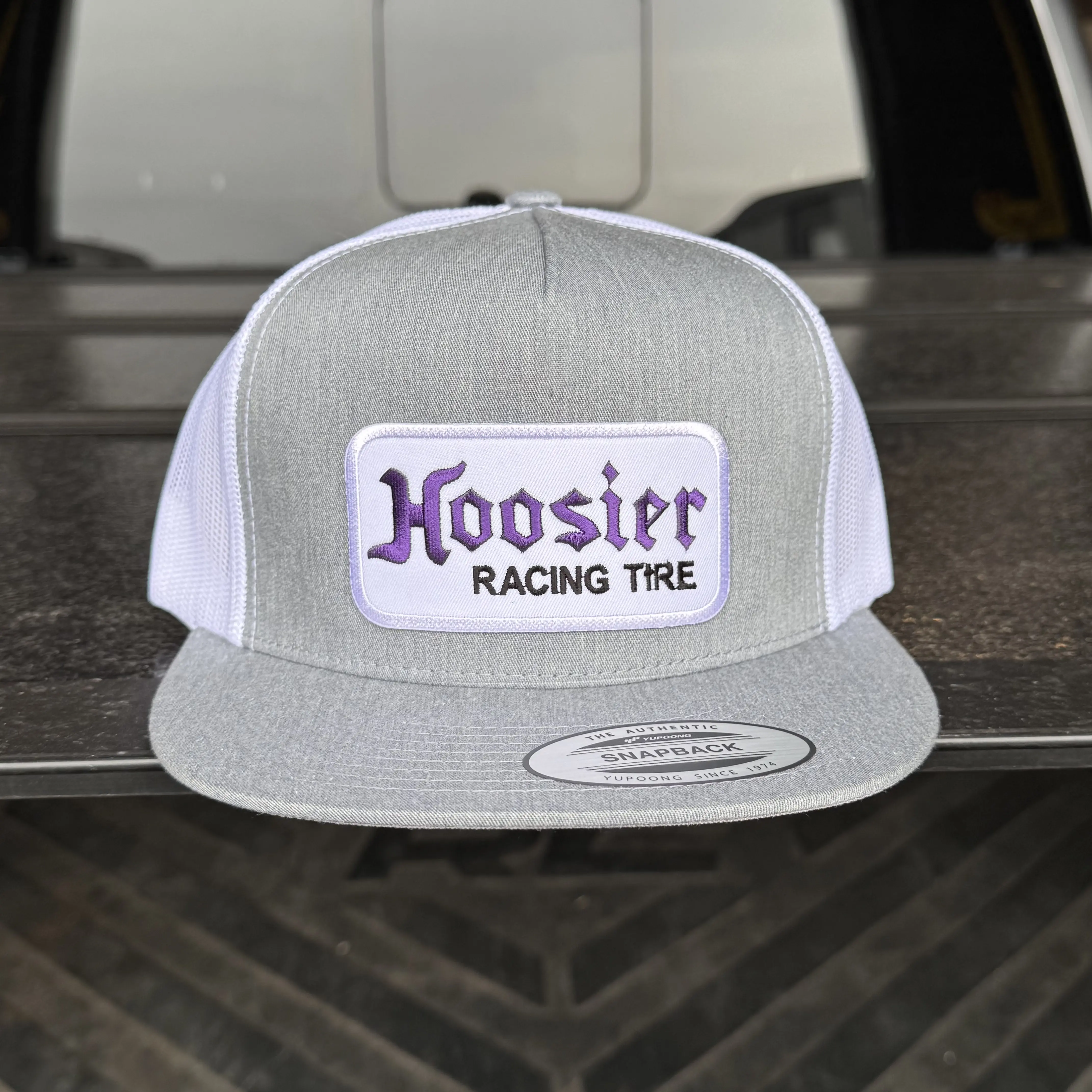 Racing Tire Grey Snapback Hat, One size fits all with an adjustable back strap. Classic Vintage Style Design