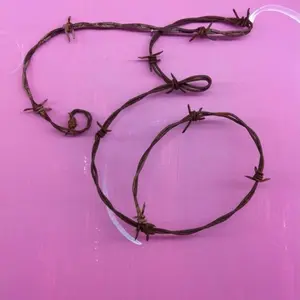 Customized Barbed Wire Art Monogram E on Pink Background Unique Design Art Piece