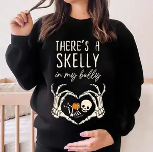 There’s A Skelly In My Belly T-Shirt, Sweatshirt, Hoodie – Funny Halloween Maternity Sweater With Baby Skeleton & Pumpkin Design, Spooky Season Pregnancy Announcement Outfit