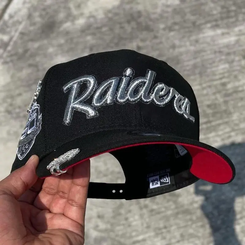 RAIDERS Nation Stand Up! New Era Vegas Script Trucker Cap - Black Out Style