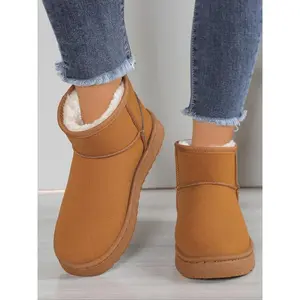 Women’s brown suede faux shearling ankle snow boots lined for casual winter walking and indoor comfort; fashionable cold-weather and everyday shoes; cozy, easy-to-wear warm boots; elegant boots.