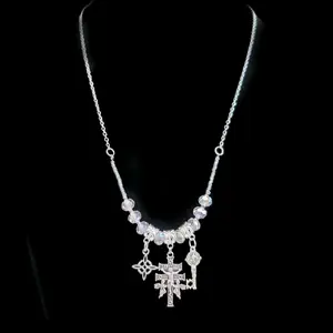 Necklace with cristals and triple protección, nudo de bruja, Cruz de Caravaca, llave de San Benito