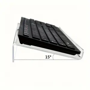 1-piece inclined PC keyboard stand made of high-toughness organic material, shatterproof and durable. The ergonomic tilted design ensures comfortable use, suitable for offices, homes and schools for easy height adjustment and storage.