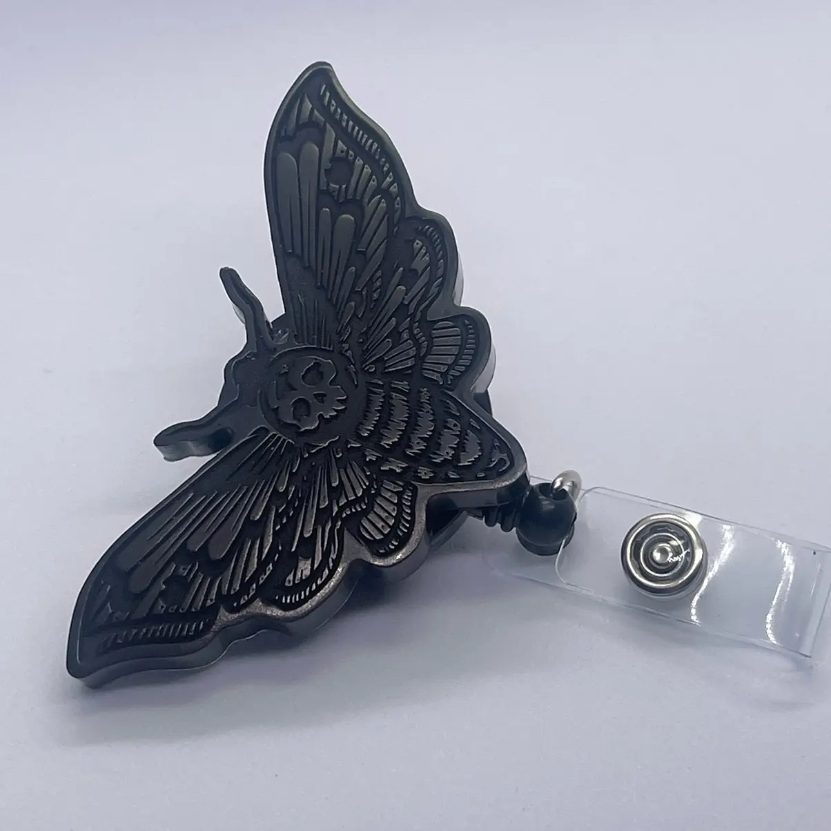 Black deadhead moth badge reel