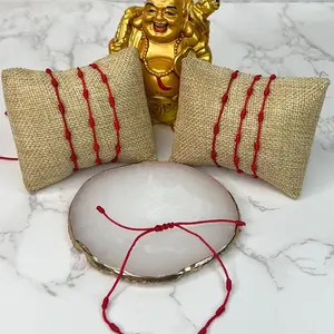 Pulsera 7 Nudos - Red Rope Jewelry with Circular Design, Featuring Textured Finish and Elegant Red Rope Accents