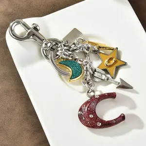 Bohemian Multi-Charm Keychain - Star, Moon, and Arrow Pendant with Glittery Accents for Women