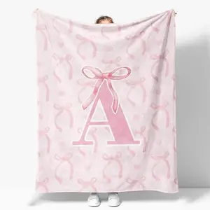 Personalized Pink Ribbon Initial Flannel Blanket — ultra-soft baby keepsake with custom name; first-year memory blanket ideal nursery decor and heirloom gift for newborns