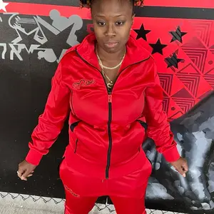 Dripping Red Tracksuit for Women - 100% Polyester Trinda, Black Piping, Custom Rubber Logo, Stand-Up Collar, Zipper Puller, Eye-Catching Design