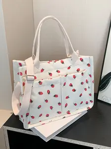 Small fresh strawberry print canvas tote bag for women Strawberry Themed Bag Large capacity multi-pocket shoulder bag Fashionable and versatile student bag Can hold mobile phones and cosmetics to meet the capacity needs of daily commuting and shopping