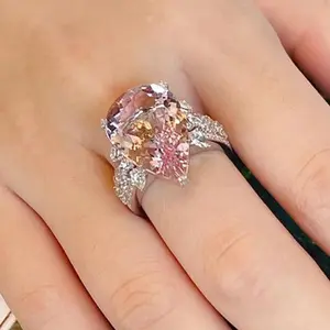 pink A luxurious hand polished Moissanite ring paired with pink zircon. Exquisite craftsmanship. Sparkling Moissanite and pink zircon. Master level aesthetic design. Excellent quality. Brilliant and radiant. High quality hand polished. Unmatched talent.