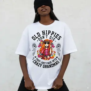 Graphic T-shirt Women's Casual "Old Hippies Are Not Dead" White Tee Floral Peace Sign Machine Washable Hippie Top |   TikTok viral tee, boho aesthetic, retro graphic shirt, casual everyday outfit, festival streetwear, gift idea