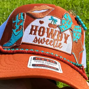 Howdy Sweetie Otto Trucker hat with teal and copper accents.