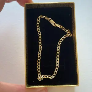 Elegant 10K solid gold curb link bracelet with a high-polish finish and secure lobster clasp.  Perfect for everyday wear or layering — a timeless, durable, and stylish addition to any jewelry collection.