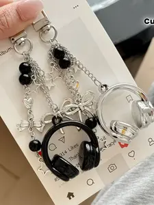 Y2K music vibes unlocked! 🎧 This headphone bag charm blends Coquette sweetness with gothic edge—perfect for spring OOTDs and bold gifting. Sparkly Bag Charm #Y2KStyle #CoquetteAesthetic #HeadphoneCharm #SpringAccessory #GiftForHer