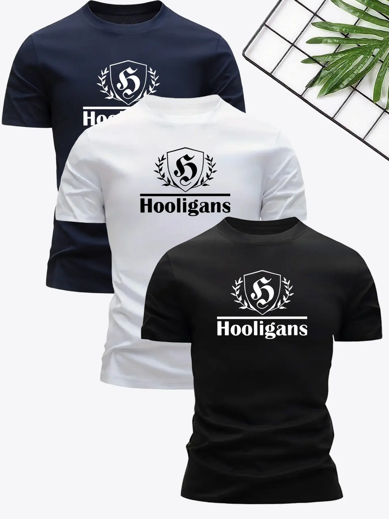 3pcs Short-sleeve Set Featuring "Hooligans" Lettering and Shield Badge Prints. with Its Bold and Eye-catching Style, It Combines Trendiness with Subculture Appeal, Making It a Distinctive Item for Streetwear Enthusiasts' Daily Outings