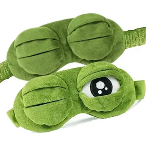 Frog Sleep Mask - A stylish shimmering sleep mask featuring an adorable "Sad Frog" design This fun plush eye mask is perfect for travel yoga napping and light-blocking its soft cotton lining gently cares for sensitive skin LY410