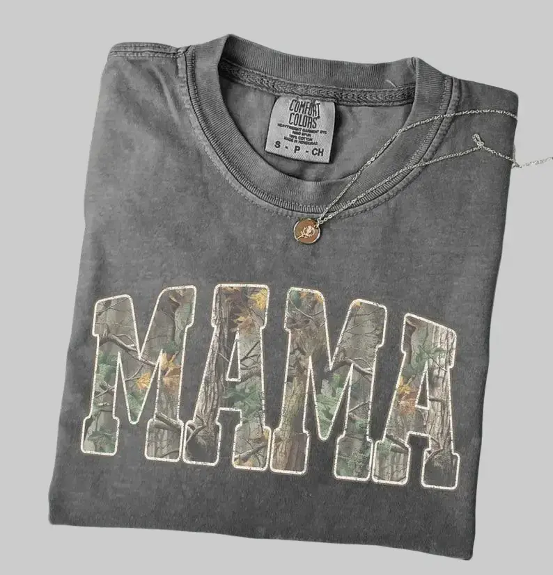 Hunting Mama Comfort Colors T-Shirt with camouflage varsity design, retro camo mama tee-perfect Mother’s Day gift for proud outdoor moms who love hunting style.