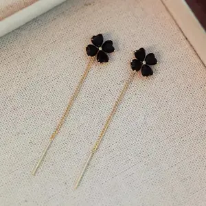 Fashionable black four-leaf clover lucky tassel earrings for women, light luxury design, new stylish ear accessories, gift for women