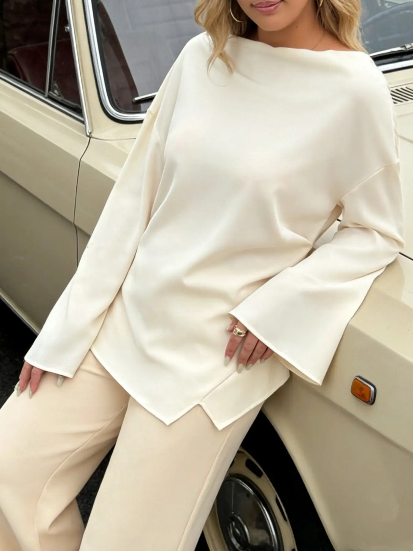 A women's minimalist high-end one neck flared sleeve shirt with irregular hem and waist cinching, exuding a slimming and gentle style. Suitable for spring and autumn, home, indoor, and outdoor wear