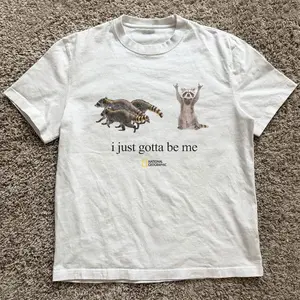 Gildan Men's and Women's T-shirt, National Geographic Raccoon “I just gotta be me” tee, Animal tee, Y2k Unisex Graphic Tees Gothic Grunge Emo Scene Amity Affliction Style Clothes Menswear Womenswear Streetwear