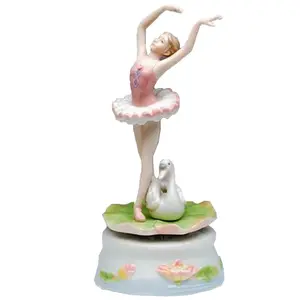 Porcelain Turning Ballerina with Swan Music Box and Plays Swan Lake