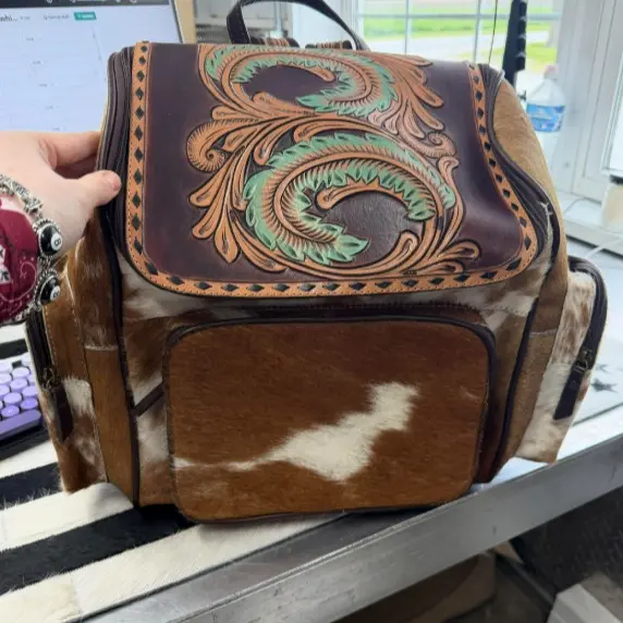 Tooled feathers & cowhide 
