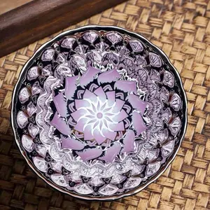 Handmade purple lotus Jian kiln teacup, exquisite floral relief glaze, traditional Chinese Jian kiln teacup, a gift or collectible that showcases cultural heritage.