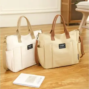 2026 Trendy Preppy College Canvas Tote Solid Color Multi-Pocket Zipper Large Capacity Convertible Bag for College Students Casual Commuter Bag
