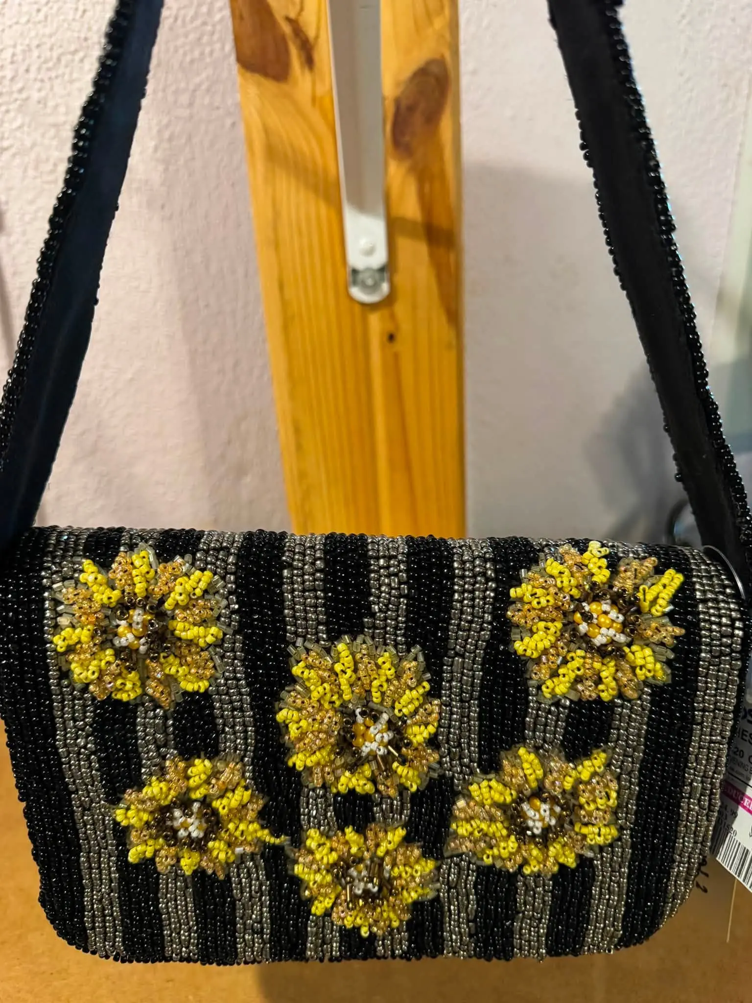 Elegant Beaded Handbag with Yellow Floral Embellishments and Black Striped Design