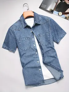 Men’s denim-style short-sleeve shirt featuring classic light blue denim fabric and a high cotton content for comfortable wear. Chest area features dual pockets, urban fashion casual style, suitable for men’s outdoor walks and everyday work commutes.