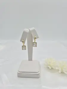 14 k gold plated earrings. (24)