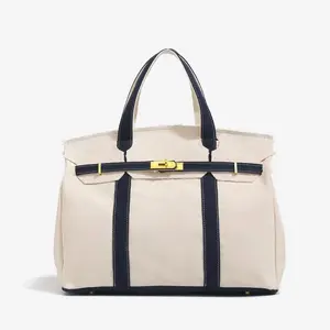 Canvas Platinum Bag for Women 2026 NewHigh-End Niche Design Color-Block HandbagLarge Capacity Commuter Versatile, Vintage distressed thread design, highlighting unique texture.