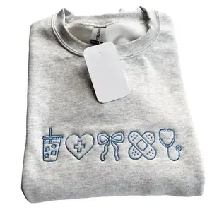 Embroidered Nurse Sweatshirt | Coquette Bow Nursing Crewneck | Nursing Student Pullover | CNA Sweatshirt | Cute Nurse Appreciation Gift GARMENTARY