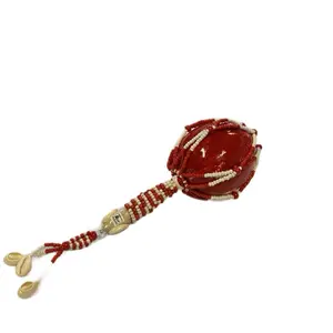 Shango orisha maraca decorated with red and white beads