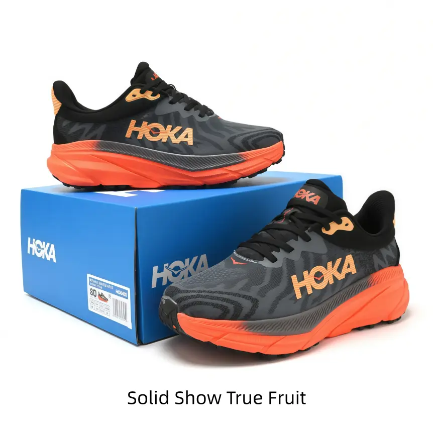 Dark textured running shoes with striking orange gradient sole, high cushion support, perfect for trail running and outdoor hiking trips